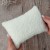 Cuddly newborn posing pillow off white.jpg