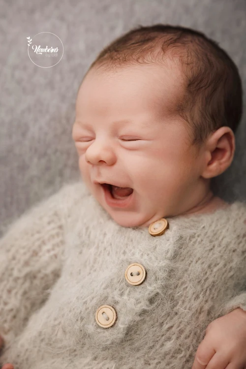 Dark grey Stell backdrop and grey newborn romper in use.jpg