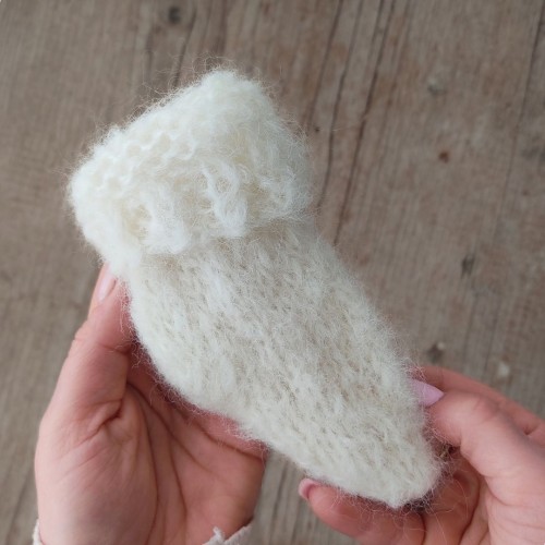 off white newborn knitted sock - close up.jpg