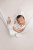 knitted newborn girl overalls in use.jpg